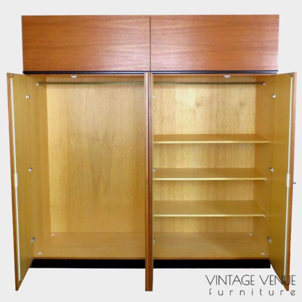 Exclusive vintage mid century design wardrobe armoire made of teak with 4 doors and 2 easy to use cabinets on top. The design of the 2 cabinets on top makes you think of the bigger KU16 Japanese Series wardrobe from Cees Braakman / Pastoe, and the bottom design of the Alfred Hendrickx / Belform wardrobe. Unfortunately in this case the designer / manufacturer is unknown. The wardrobe has a beautiful teak woodgrain and is in good condition. Period: 1960s. 