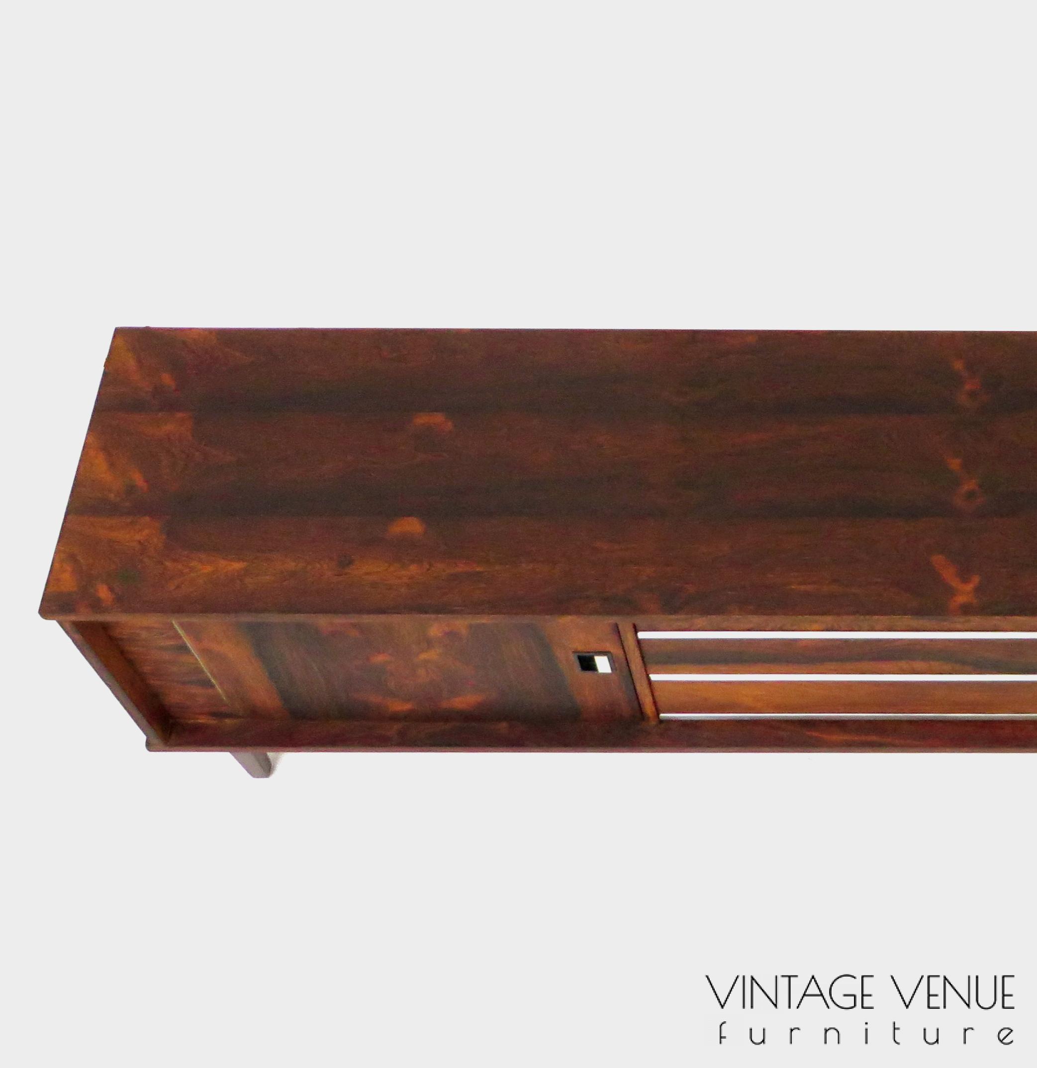 Vintage mid century modern low sideboard made of rosewood palisander, on 4 wooden legs with 2 sliding doors and 3 drawers with stylish handles & legs Period: 1960s Vintage retro lowboard dressoir tv-meubel van rosewood palissander met 2 schuifdeuren, 3 lades & stijlvolle handgrepen en pootjes, jaren 50 60 70