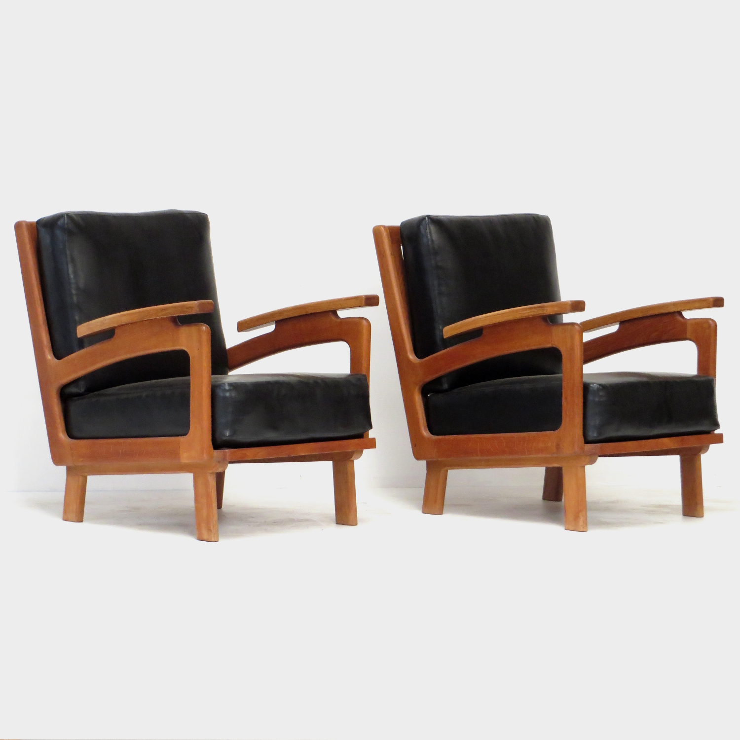 Profile photo of the front of the two vintage lounge armchairs