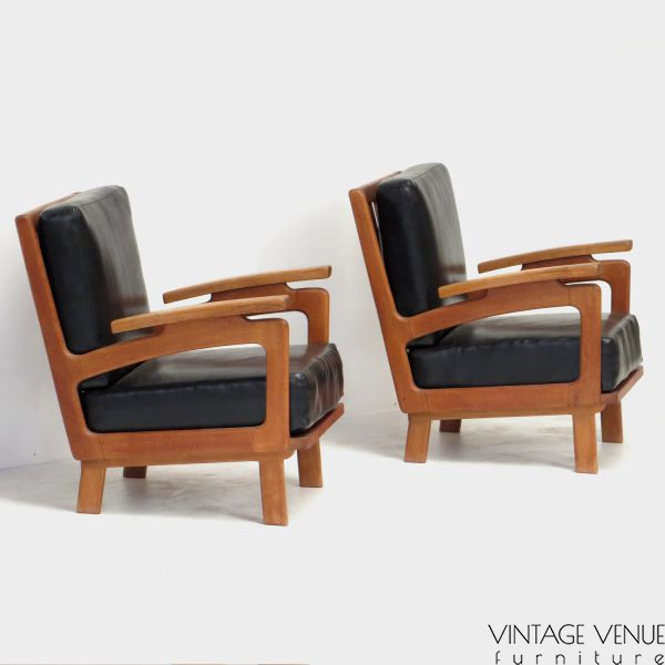 Photo of the side of the two vintage lounge armchairs